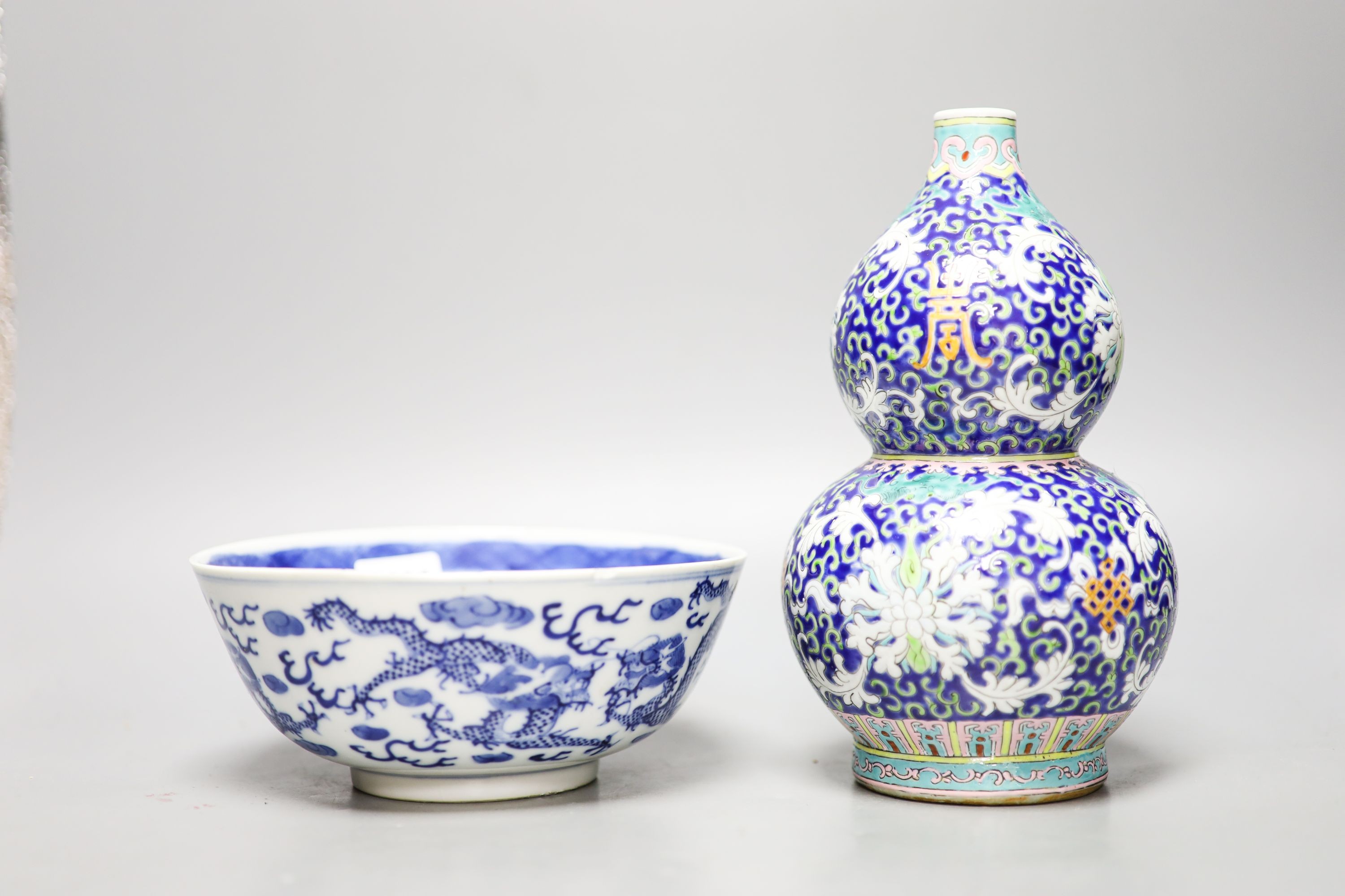 A 19th-century Chinese blue and white dragon bowl and a Chinese enamelled porcelain double gourd vase 22 cm high